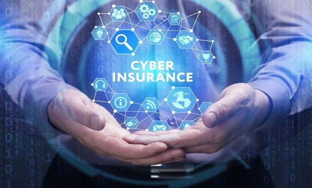 Man holding symbol that says cyber insurance