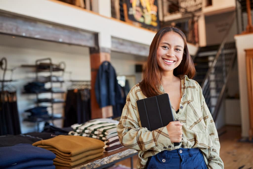 Female business owner holding tablet