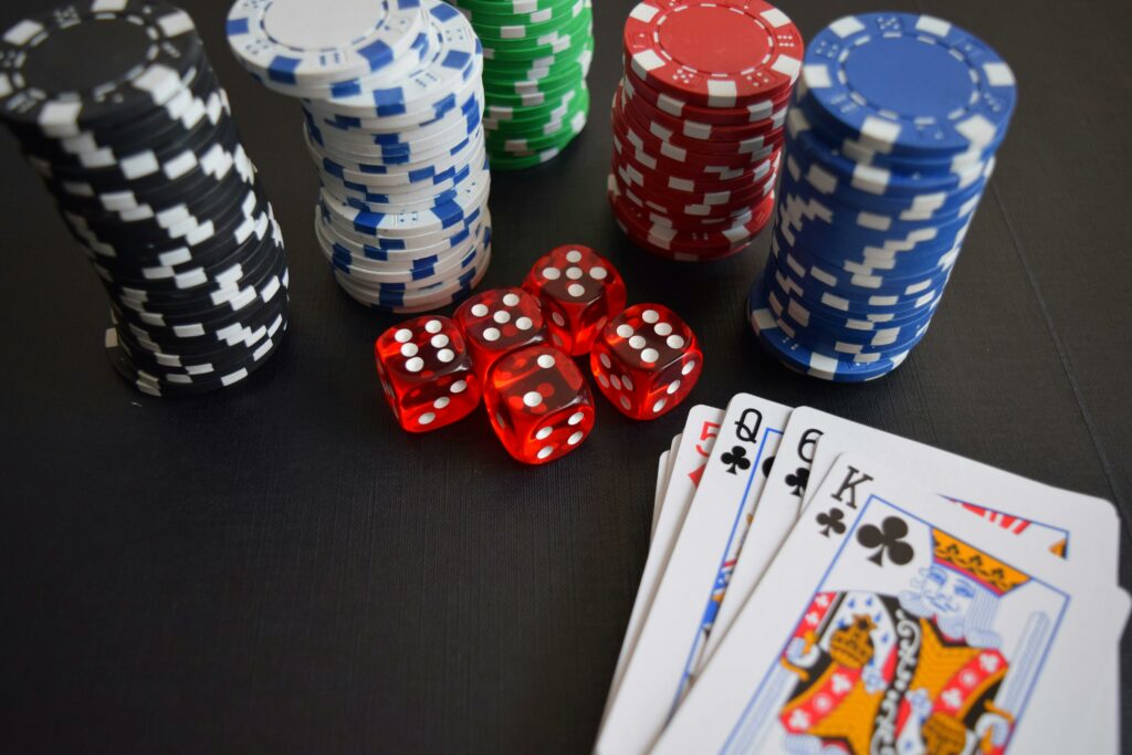 Playing cards and poker chips sitting on a table